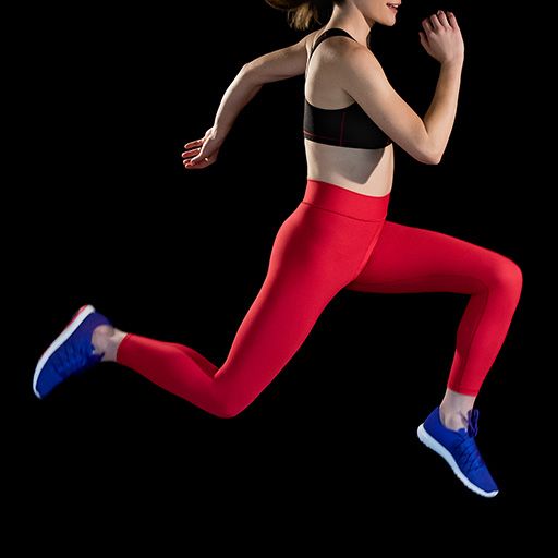Photograph of woman in Marena Sport garments jumping on a black background